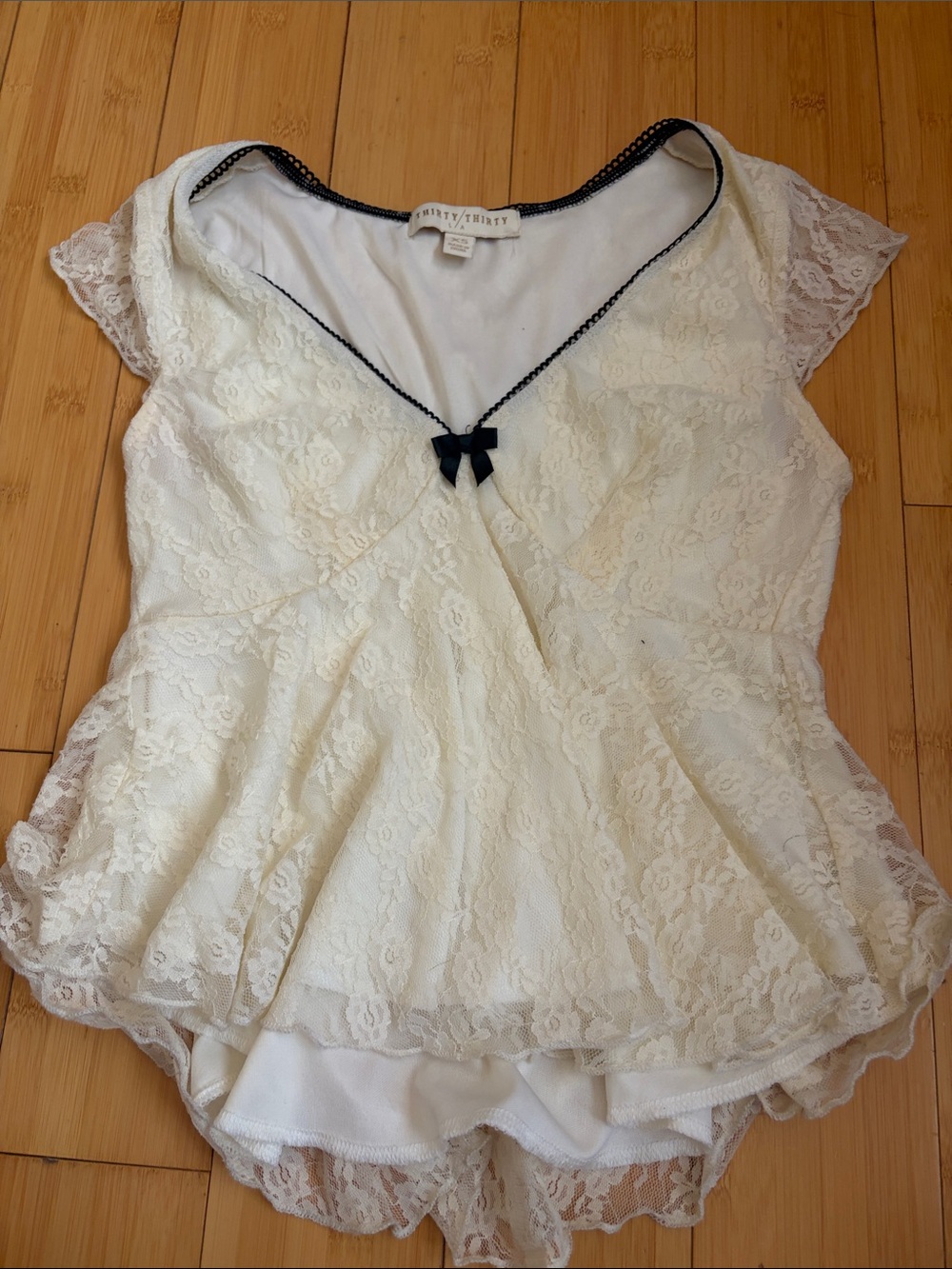 Women's Cream Lace Peplum Top with Navy Trim